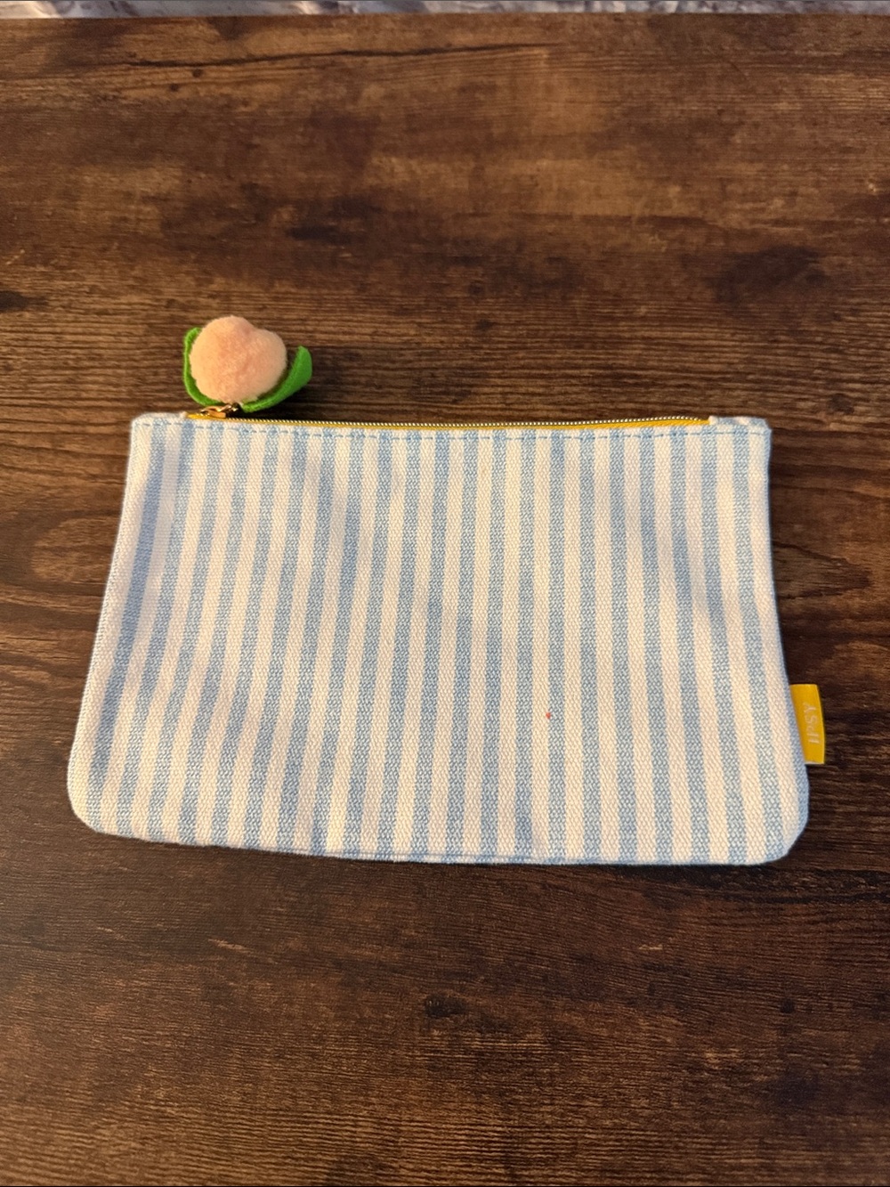 ipsy Blue and White Striped Pouch with Peach Charm